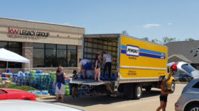 people unloading trucks with donations cedar rapids iowa